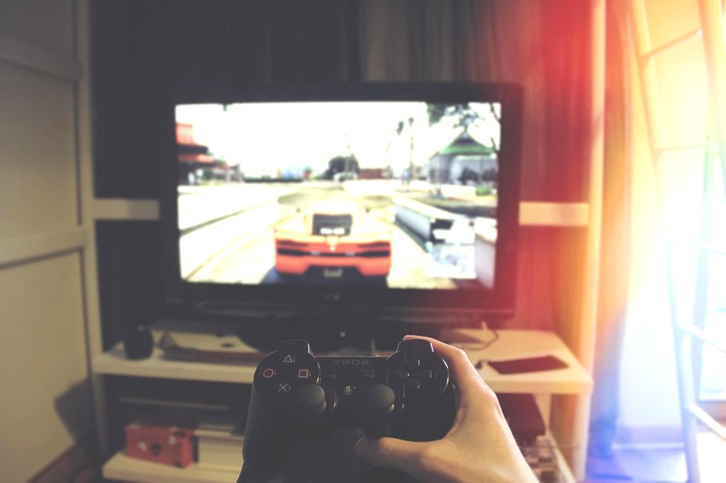 Group enjoying premium gaming lounge with neon lights